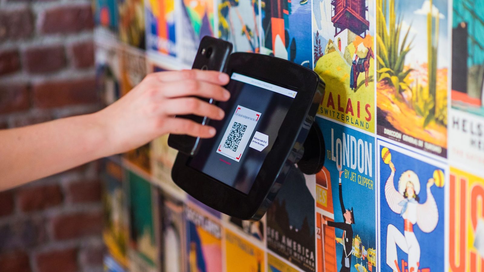 Guest scanning a QR code to open a restaurant menu on a phone